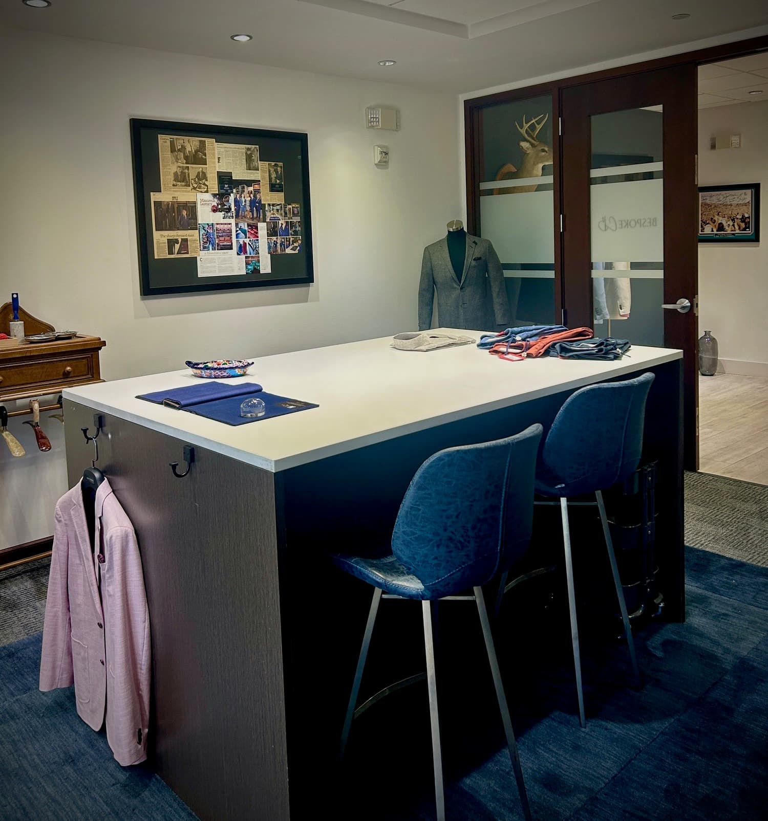 A client styling station with two stools in the studio